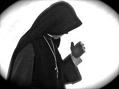 "Nun Deep in Prayer" © Robert Frank Gabriel; Creative Commons license