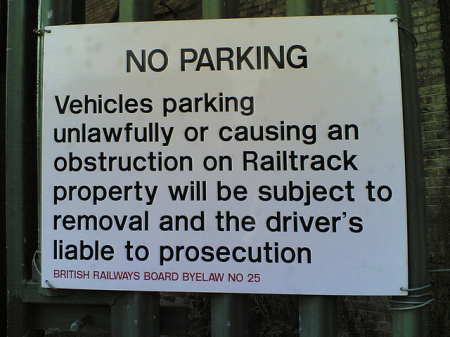 Photo of &quot;No Parking&quot; sign with multiple errors