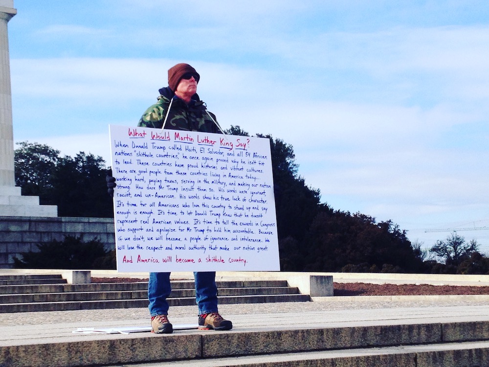 Protester with sign at Lincoln Memorial (January 2018) © Briana Loveall