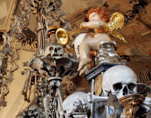 Religious shrine with an angel, skulls, and bones