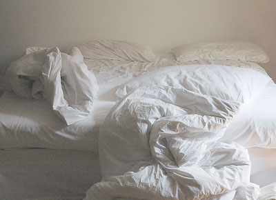 Image of an unmade bed