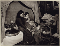 Mother with two young children by Arthur Rothstein; Library of Congress